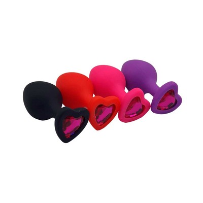 Plug Anal Cônico em Silicone no Tamanho ''M'' com Detalhe de Joia na Base de Coração - Topo Toys | 7 x 3,5 cm | Disponível em 4 Cores