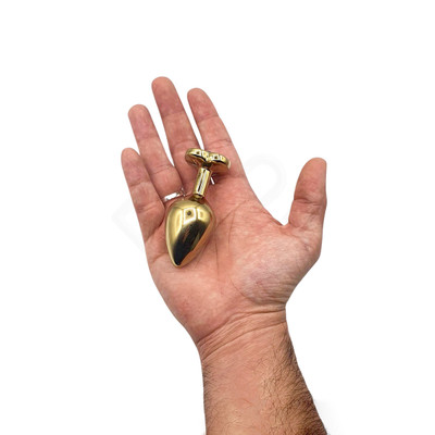 Plug Anal Dourado "M" no Formato Cônico com Detalhe de Pedra Brilhante na Base de Coração | 7 x 3,3 cm | Disponível em 9 Cores